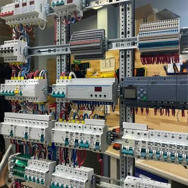 Electrical panel with circuit breakers, wiring, and control components for power distribution and management.
